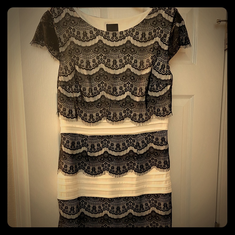 Cream and black form-fitting midi with cap sleeves